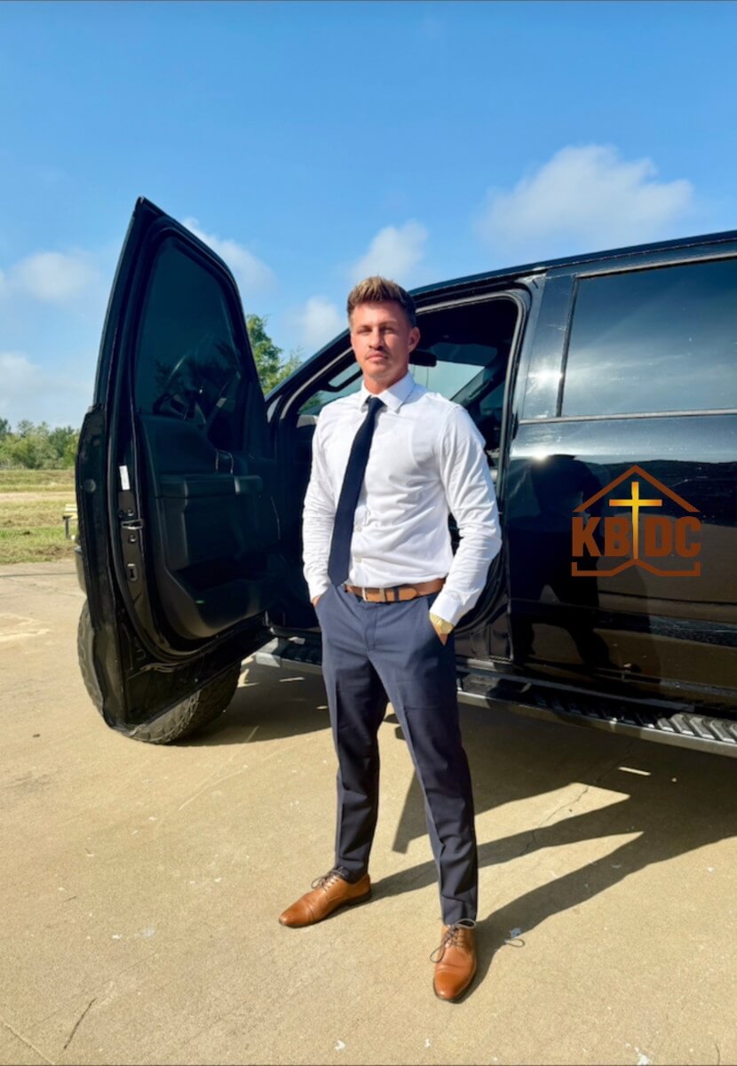 kbdc founder standing in front of car